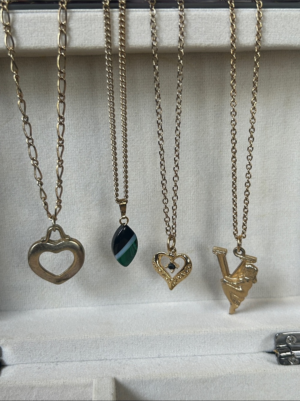 COLLECTION OF FOUR DAINTY GOLD-TONE PENDANT NECKLACES